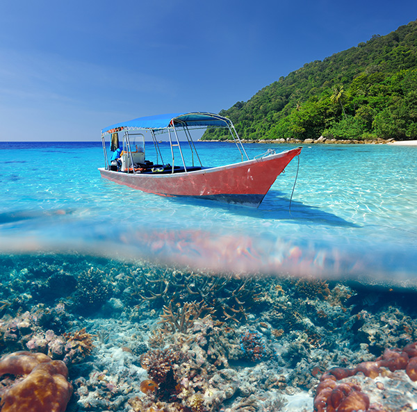 Picture of boat on ocean in Boracay with coral